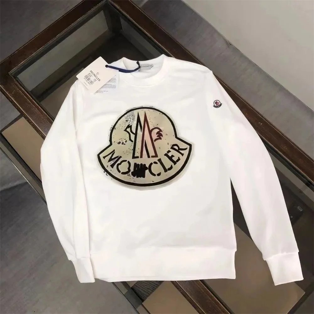 White sweatshirt with a logo on a reflective surface