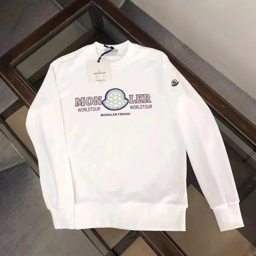 White sweatshirt with branding on a reflective surface