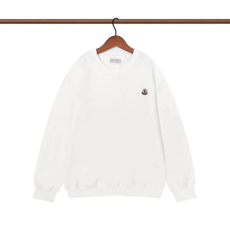 White sweatshirt with a small logo on a hanger against a white background