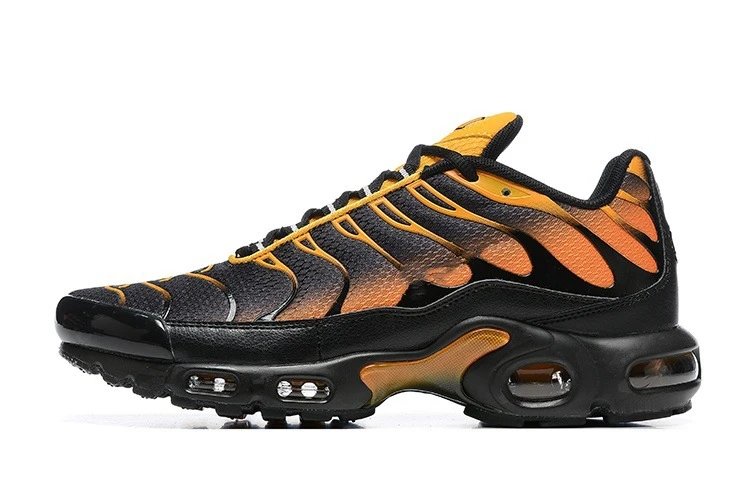 Black and orange sneaker with visible air cushioning on a white background