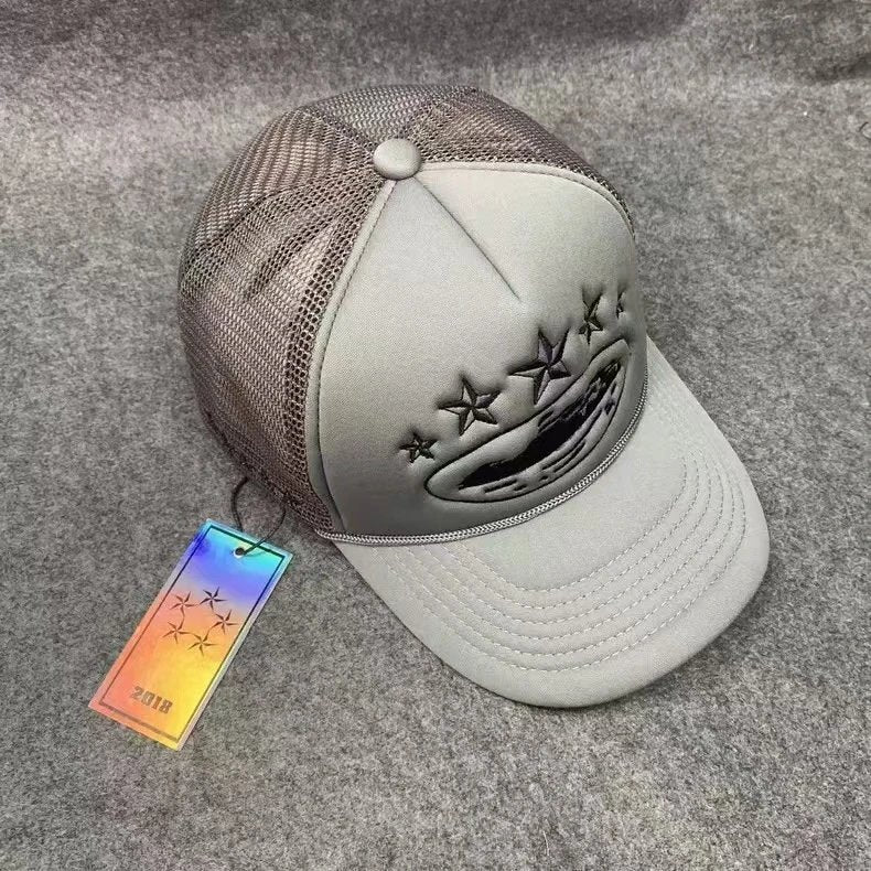 Gray cap with star design on a textured surface