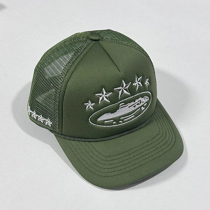 Green trucker cap with star and logo design on a light gray background