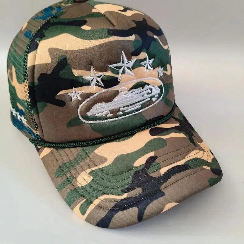 Camouflage baseball cap with embroidered design on a light gray background