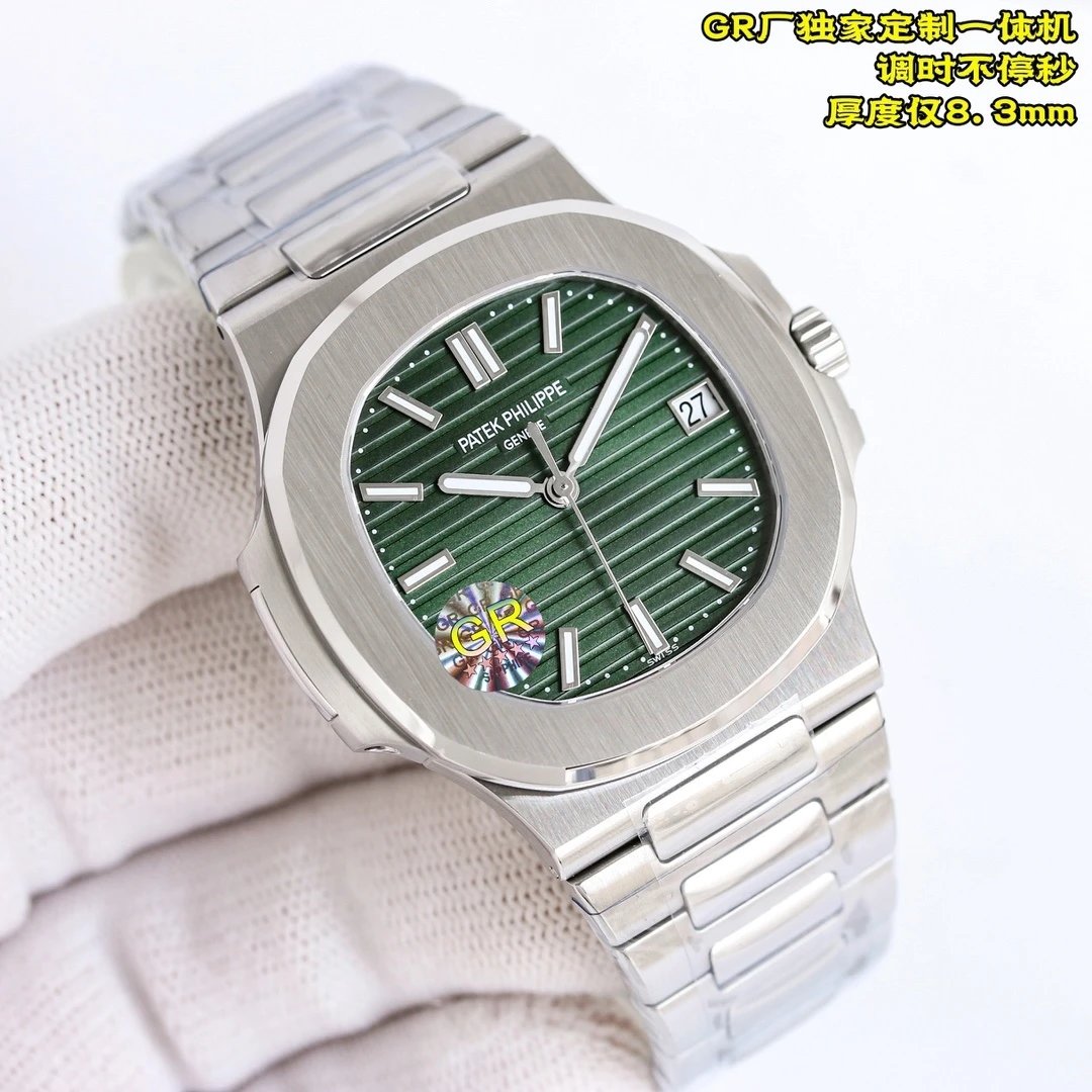 Silver watch with green dial on a white background