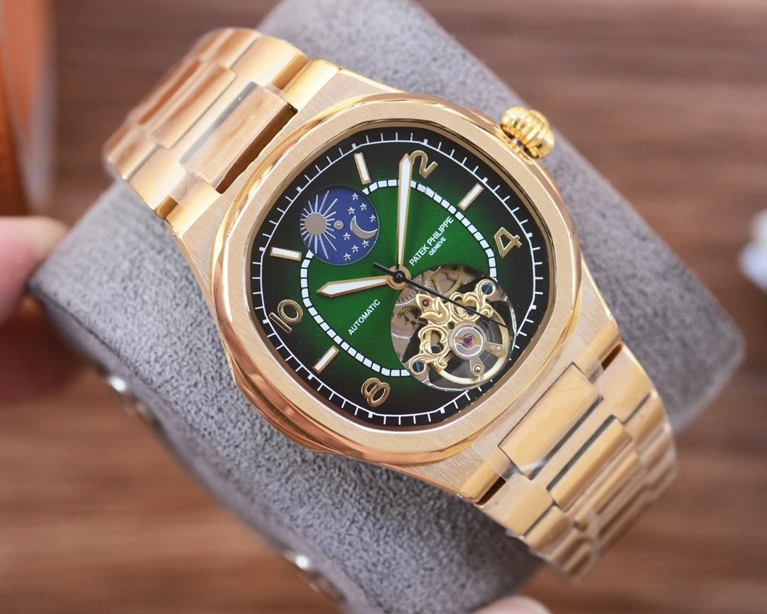 Gold wristwatch with a green face held on a gray stand.