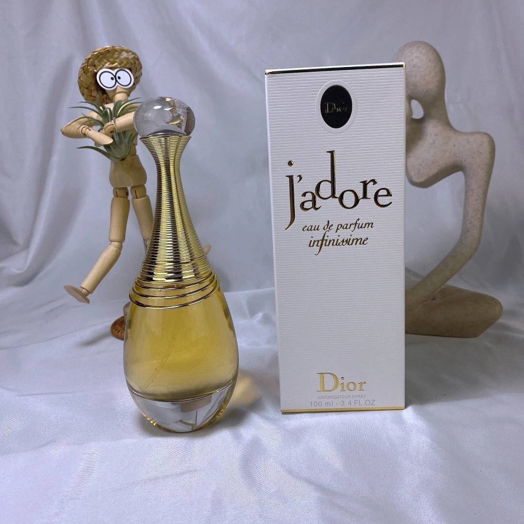 Dior Jadore perfume bottle and packaging on a light background