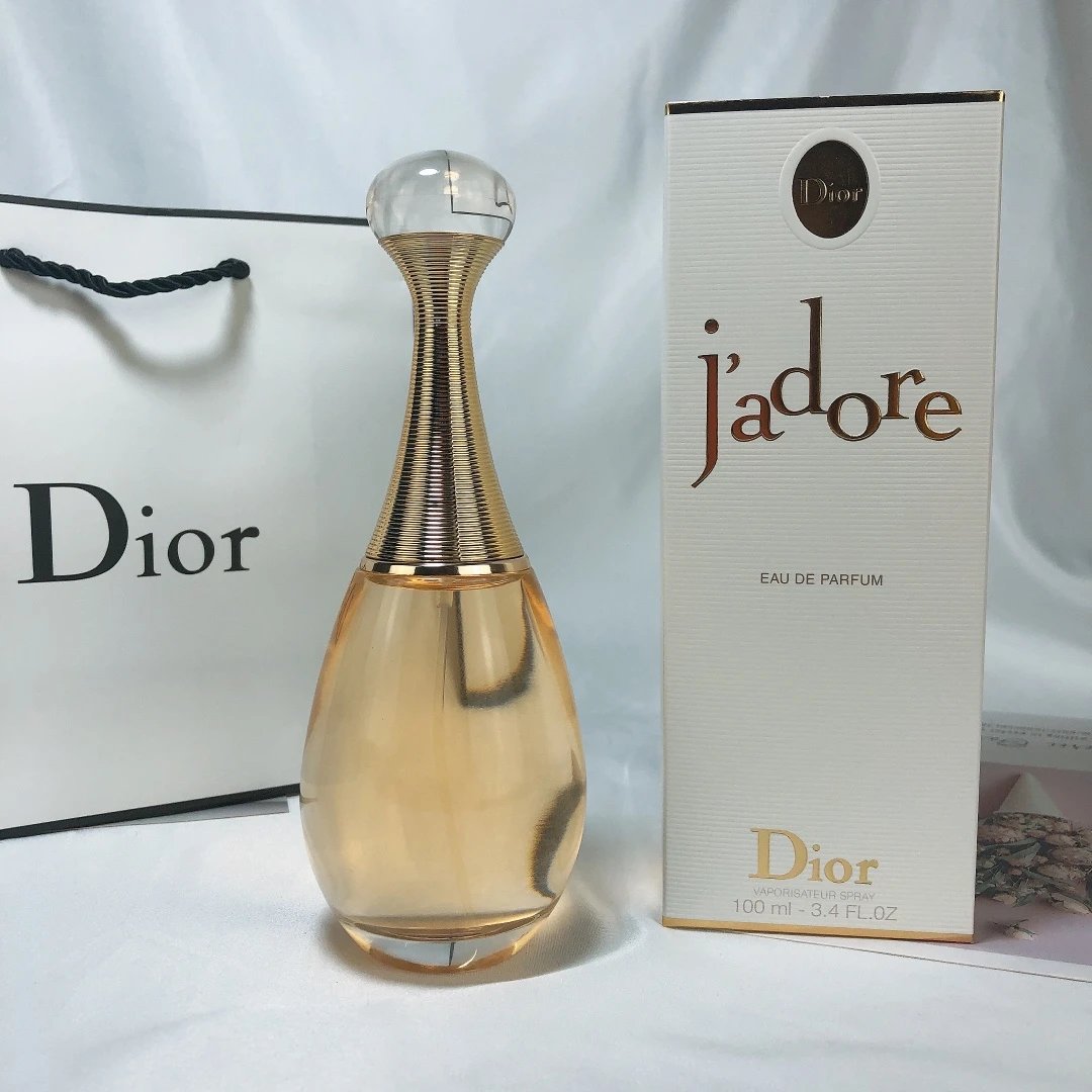 Dior J'adore perfume bottle and packaging on a white background