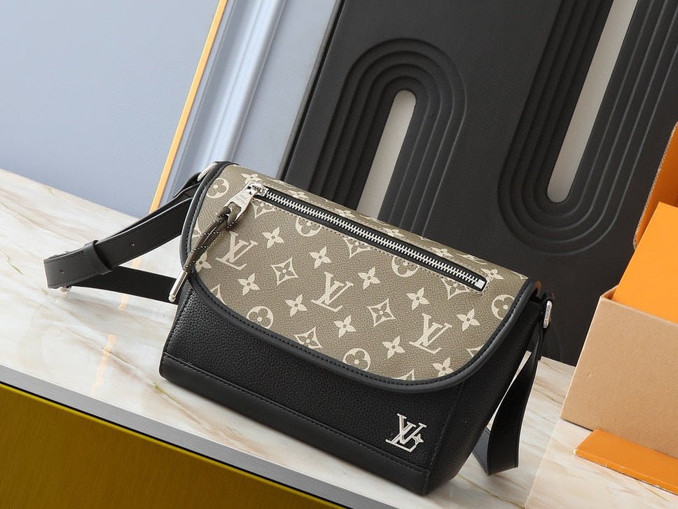 Designer handbag with monogram pattern on a wooden surface