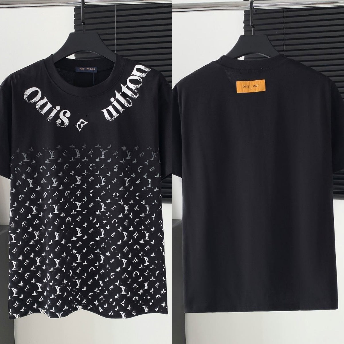 Two black t-shirts with brand logos on hangers against a neutral background