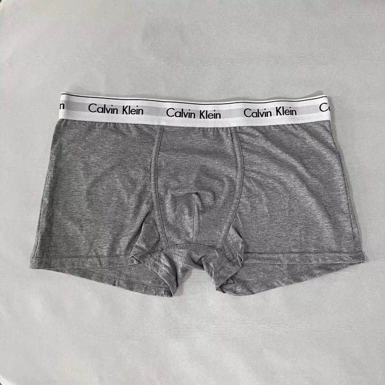 Gray Calvin Klein boxer briefs on a light gray background
