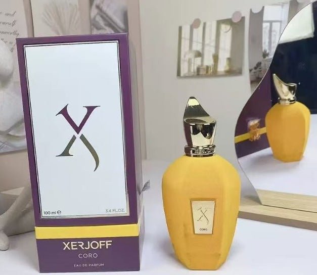 Yellow Xerjoff Coro perfume bottle with packaging on a white surface