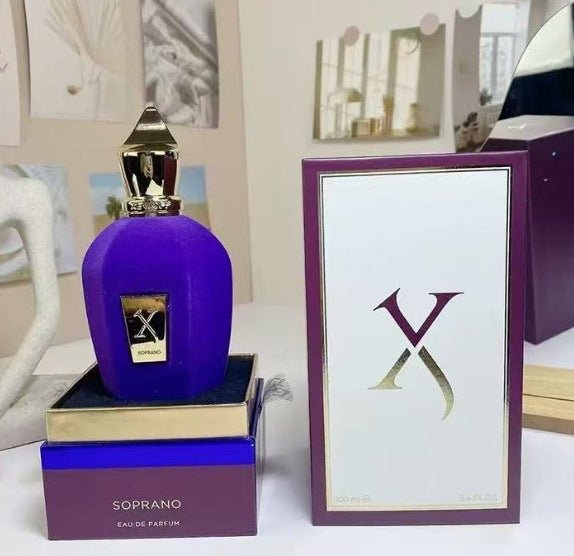 Purple perfume bottle with packaging and box on a white surface